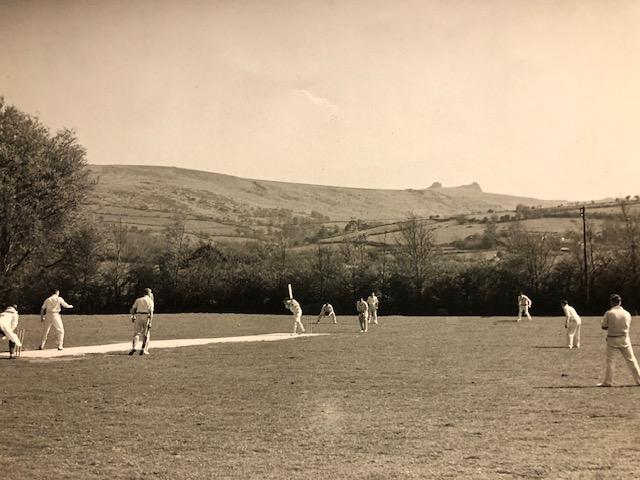 A black and white photo of a cricket match probably taken in the 1940s